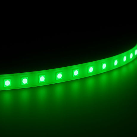 A single-color LED strip on a dark background shining onto a reflective surface.