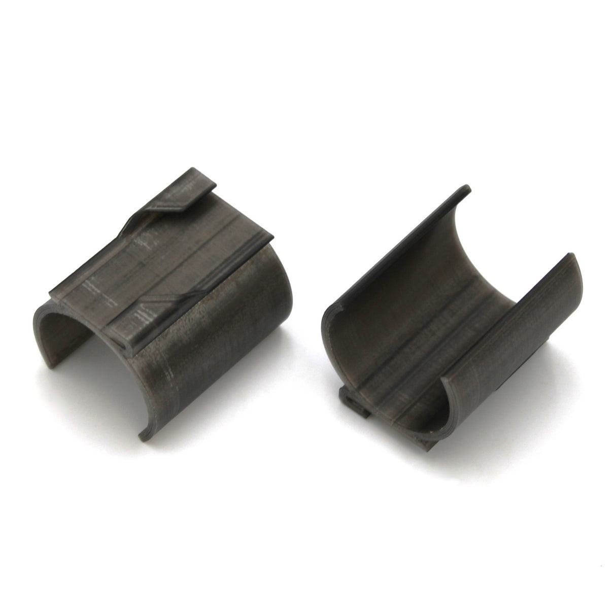 Two Drop Ceiling T-Bar Clips for 1.5" round profiles are placed side by side on a white surface, showing their curved, semi-cylindrical shapes and smooth inner sides.