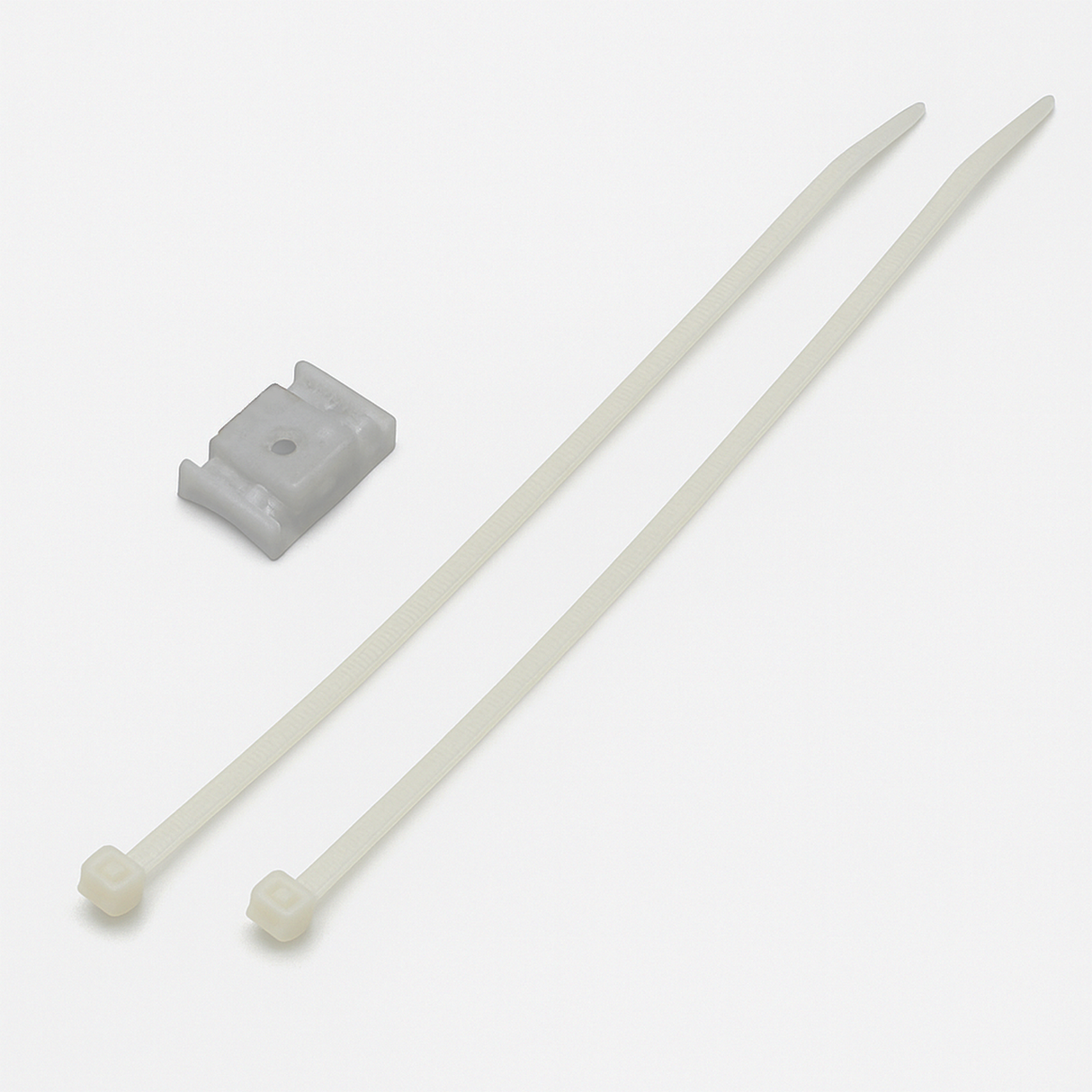 Two white plastic zip ties and a small, rectangular gray polycarbonate Suspension Clip for Neon 360 Series with a center hole are shown on a plain white background—ideal for securely mounting your Neon 360 profile.
