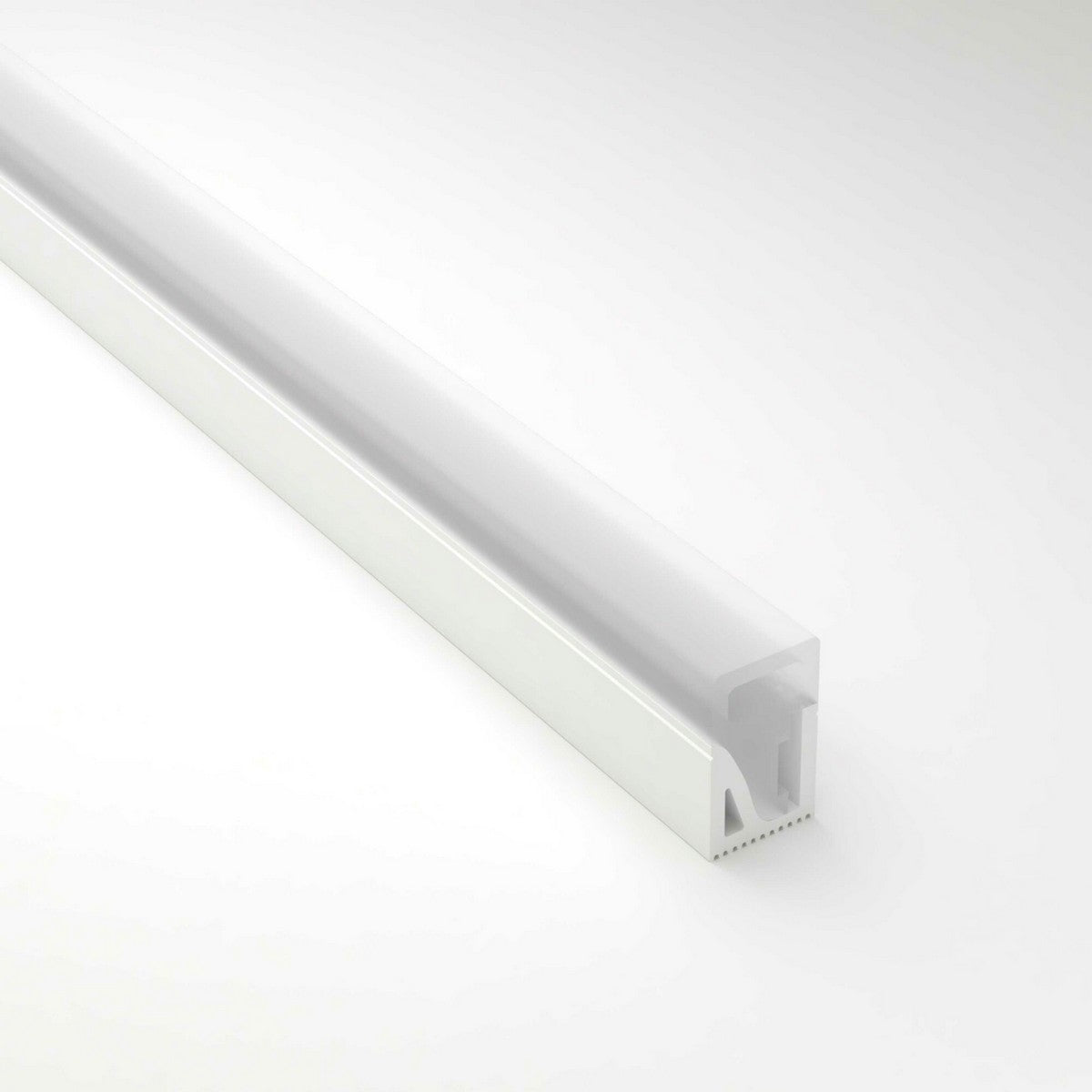 The Flexible LED Neon Light Silicone Profile, Model Neon Las Vegas, is a white silicone diffuser channel with a frosted cover. Its rectangular design ensures even light distribution, ideal for decorative lighting against a plain gray background.
