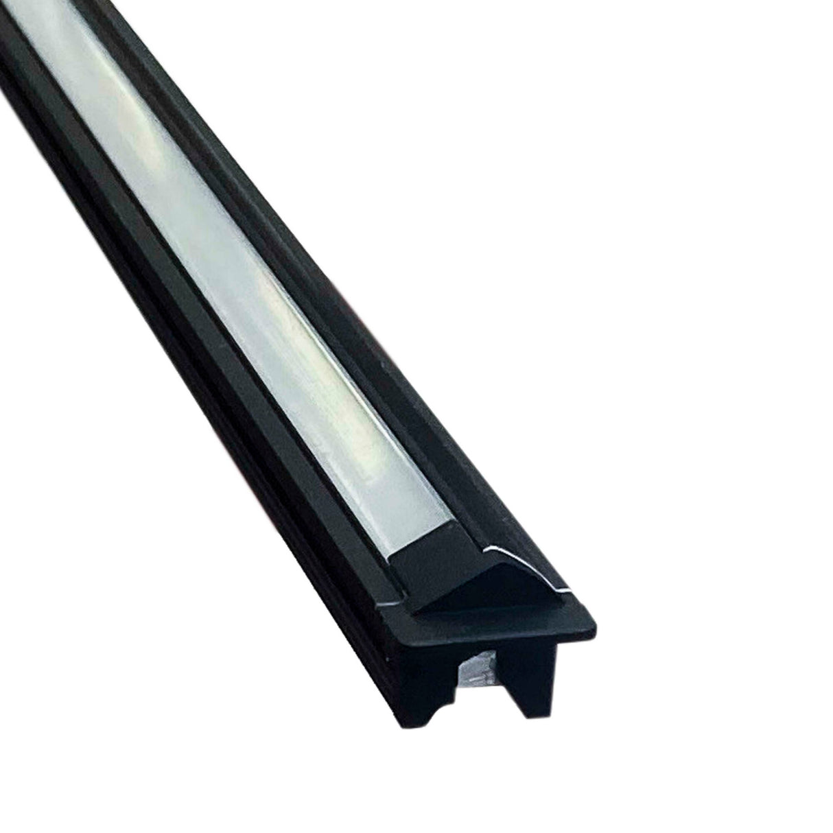 A close-up of the Recessed Angular LED Channel ~ Model Amsterdam Mini, featuring a black, rectangular design with a frosted cover and durable aluminum construction, shown against a white background.