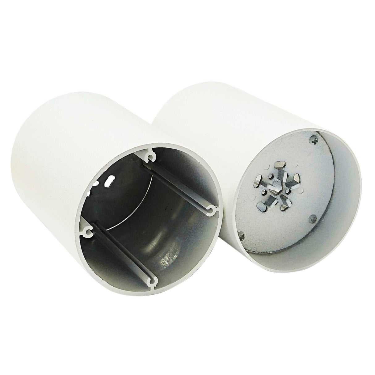 Two cylindrical white metal End Caps for Cartago Profile, each open at one end, reveal interior mounting brackets and screw terminals—designed as housings for lighting fixtures or LED profile installations.