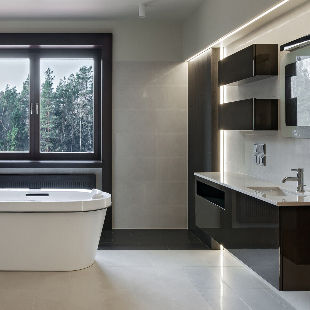 Modern bathroom with a large window, white tub, sleek black and white cabinetry, wall-mounted sink, and minimalist fixtures. The Montana 1.1 Ceiling/Wall Recessed Linear LED Lighting Profile highlights neutral tones and clean lines.