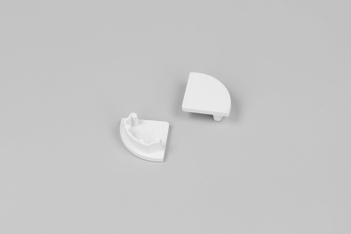 Two white, semi-circular End Caps for D1 Click Cover, made of durable ABS, are shown on a grey background—one with a smooth top, the other displaying pegs and indents underneath for secure LED channel fitting.