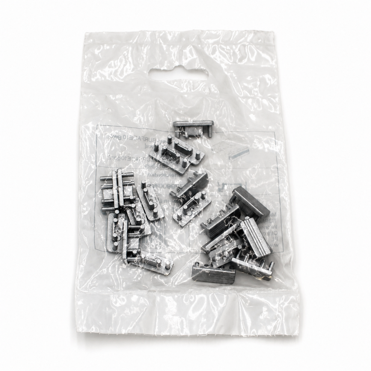 A clear plastic bag containing multiple small metallic End Caps for Surface10 Profile, displayed on a white background.