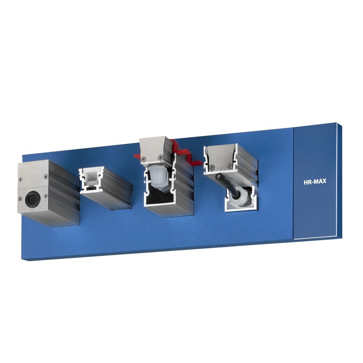 A blue display board with four mounted metal profiles, each sectioned to show internal structures and labeled Indoor-Outdoor Driveway Lighting Channel System ~ Model Klus HR-MAX, demonstrates uses like outdoor or LED lighting.