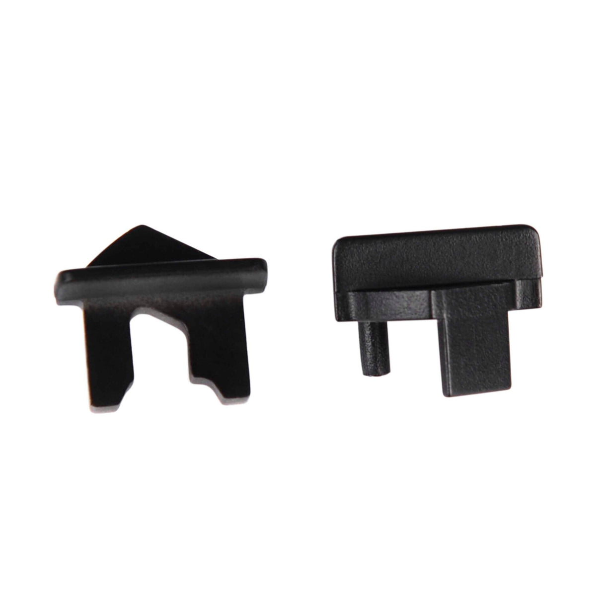 Two End Caps for Amsterdam Mini Profile, made of small black plastic with geometric shapes, flat surfaces, and protruding tabs, are shown side by side on a white background—ideal accessories for the fixture.