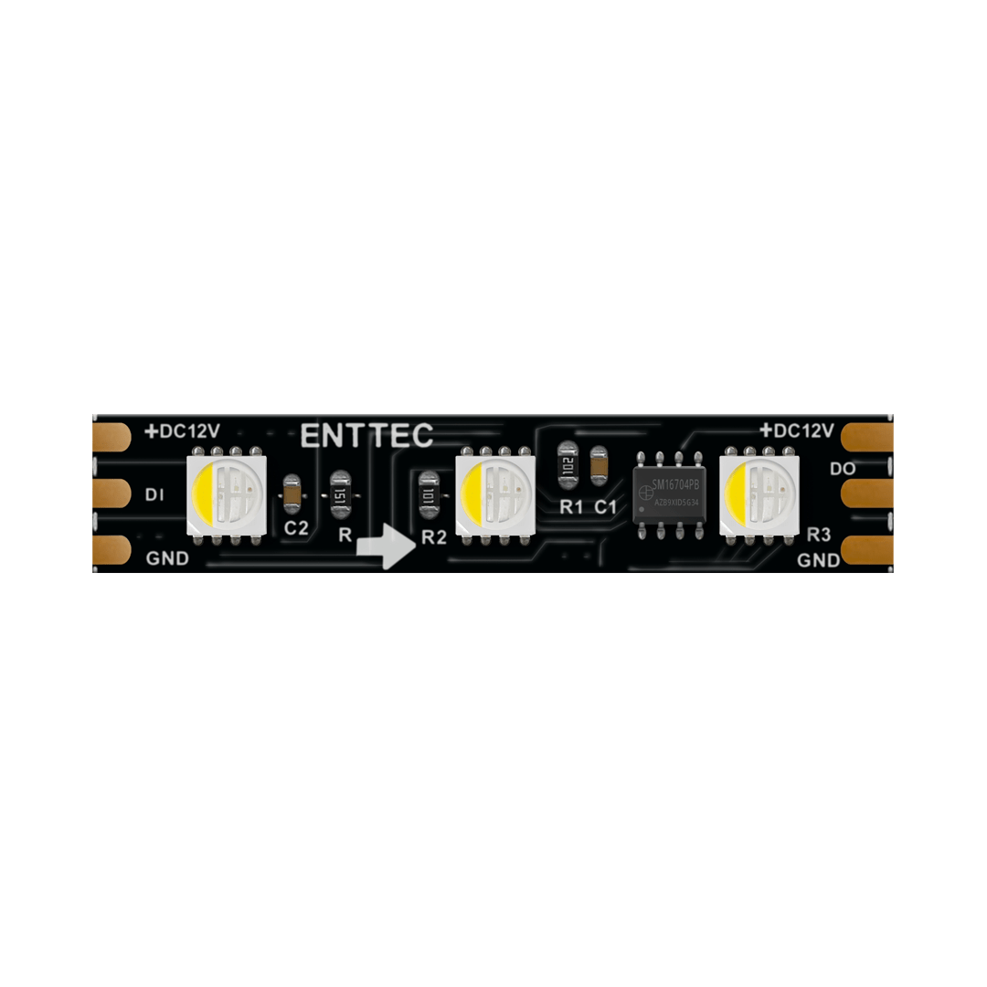 Close-up of a Long-Range RGBW Pixel IP20 LED Strip (12V) ~ Enttec 8PX Series segment, showing three LEDs, electronic components, and copper pads labeled for power, data, and ground.