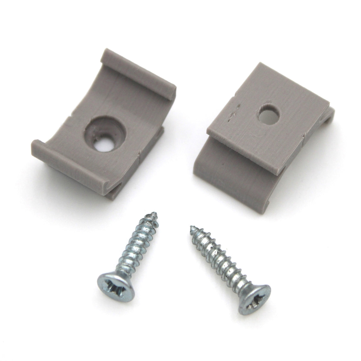 Two gray Surface Mounts for Yukon Profile and two silver screws are shown on a white background. These 3D printed plastic brackets from Wired4Signs USA are used as mounting accessories for the Yukon LED profile.