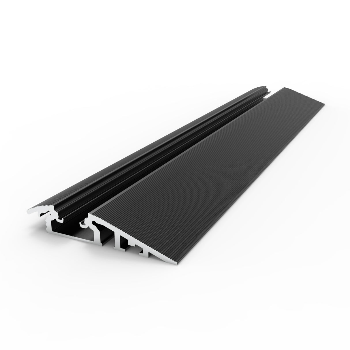 The Floor Transition Strip LED Channel ~ Model Broadway is a black and silver metal ramp with a ridged surface, engineered as a treadable threshold for smooth movement between floor levels. It is displayed against a white background.