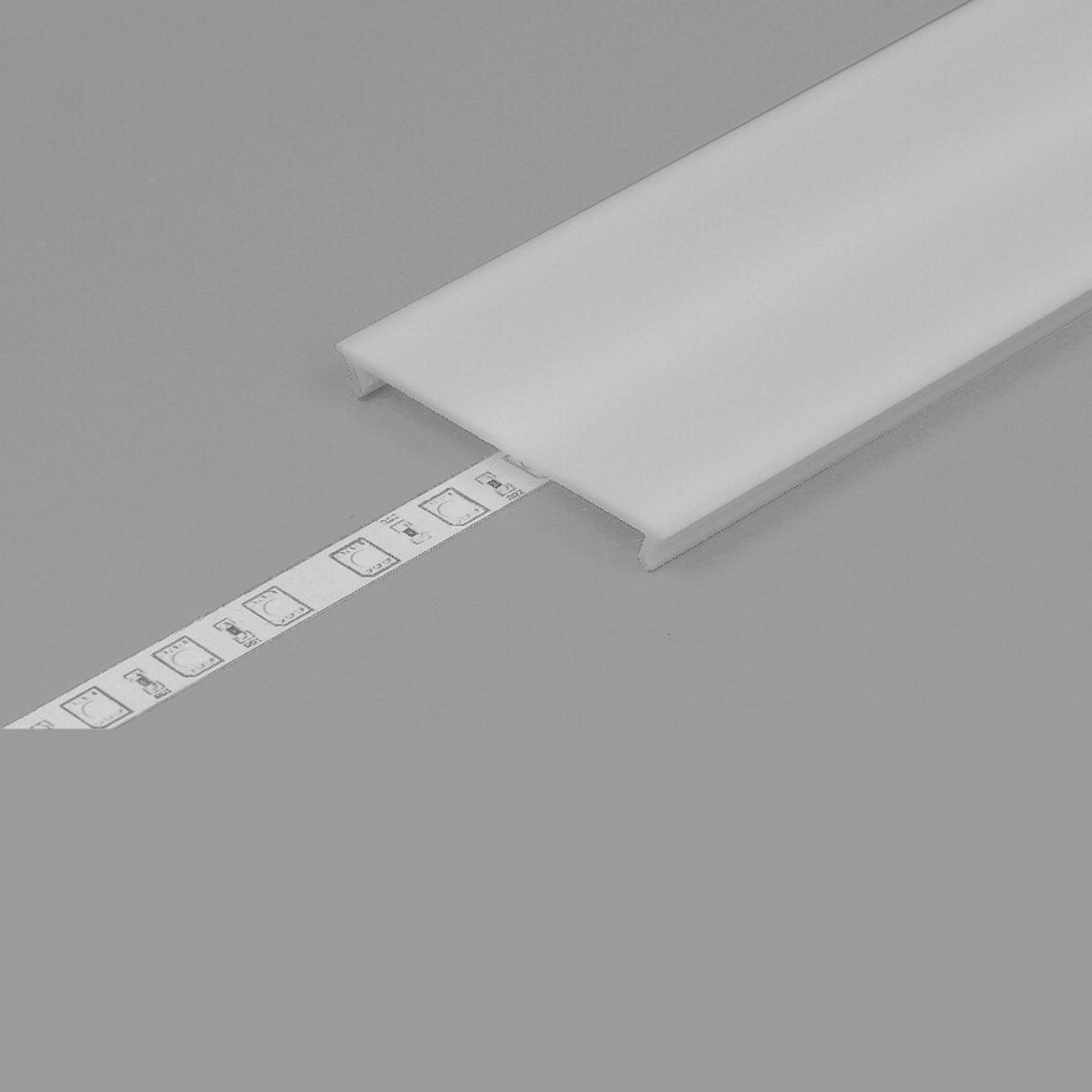 The LED Channel Cover ~ C10 Click, featuring a flat, translucent opal PMMA design, partially covers a white LED strip light and is set against a gray background.