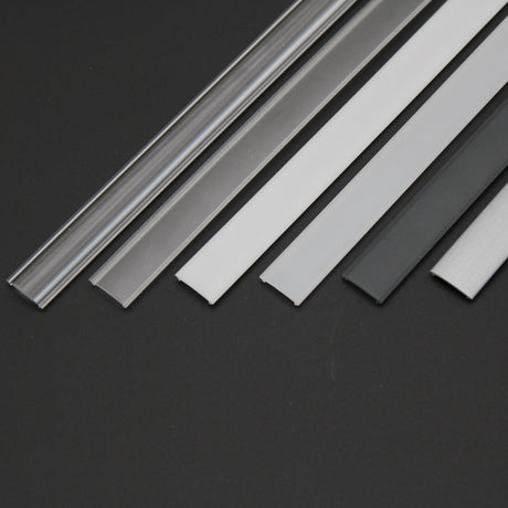Five flat LED Diffuser strips for Standard Easy-On Profiles in clear, white, gray, and translucent polycarbonate are arranged side by side on a black background. Suitable for use with IP65 range profiles.