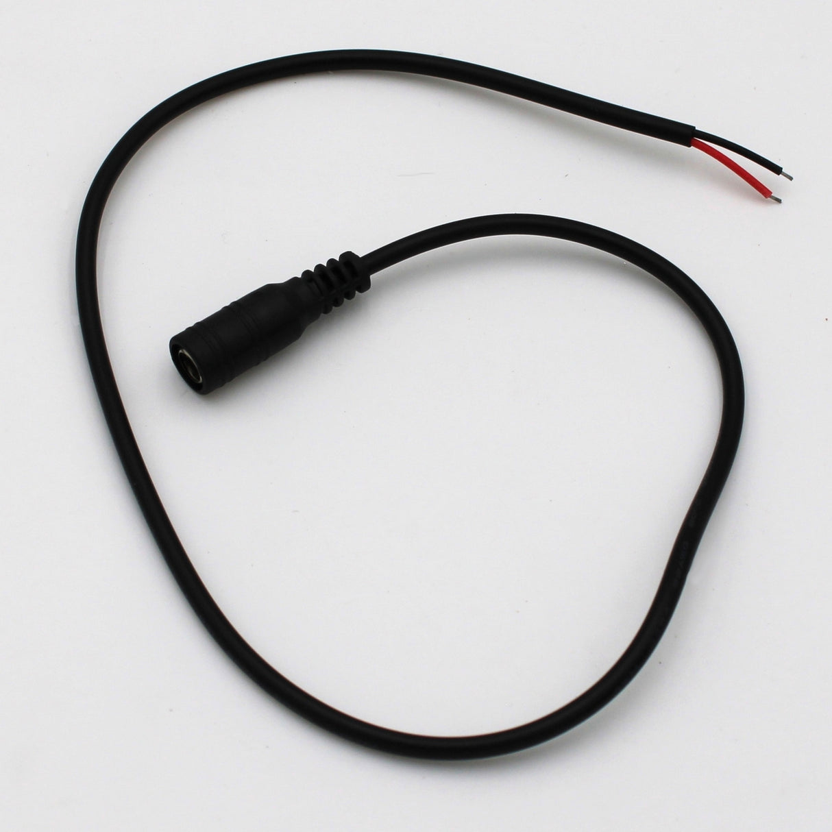The DC Female 20inch Jack wire features a black barrel connector on one end and two exposed red and black wires on the other, perfect for low voltage applications. Displayed on a white background.