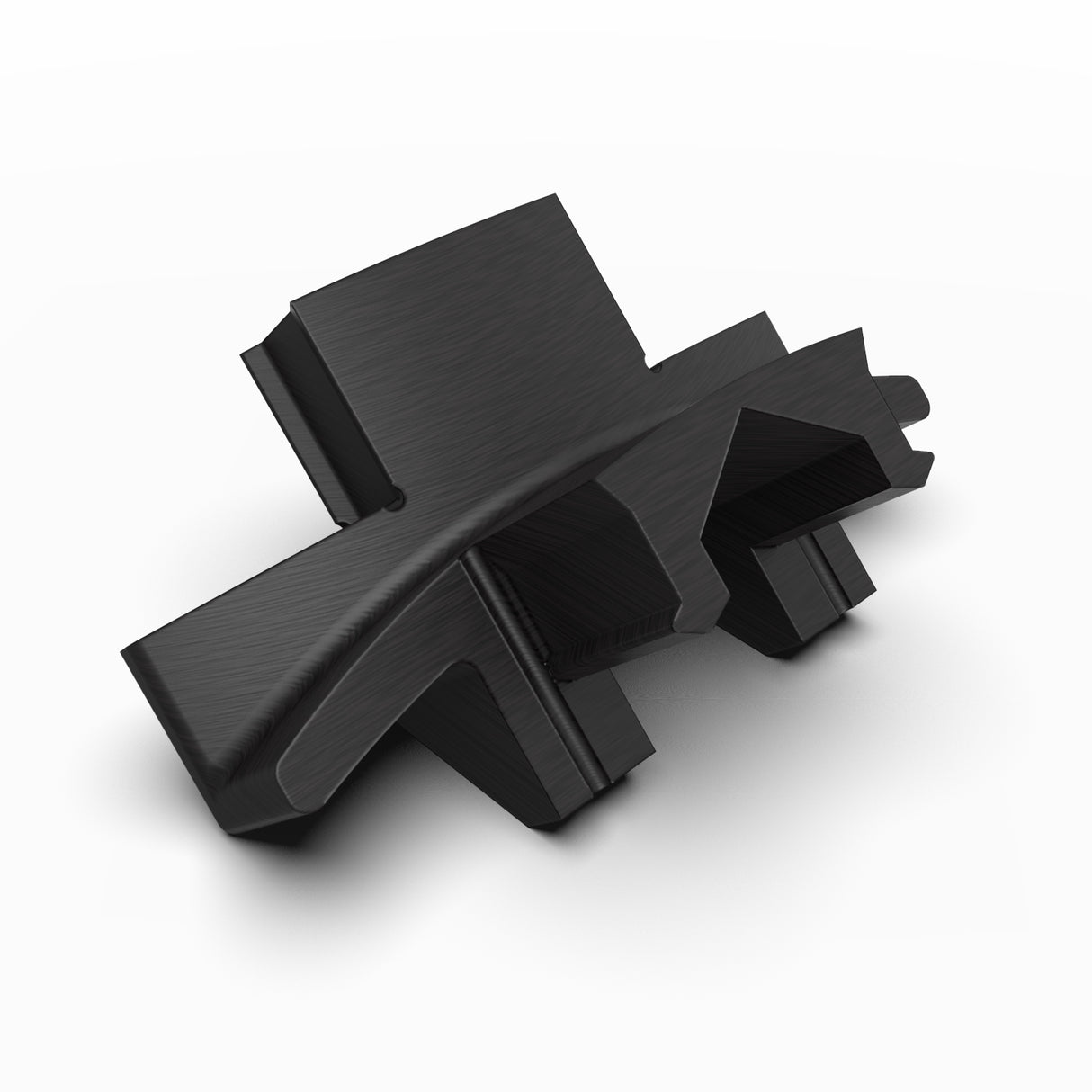A black, angular Plastic Corner Connector for Dubai Profile with sharp, geometric shapes and a metallic texture sits on a white background, its abstract 3D form reminiscent of modern architectural design.