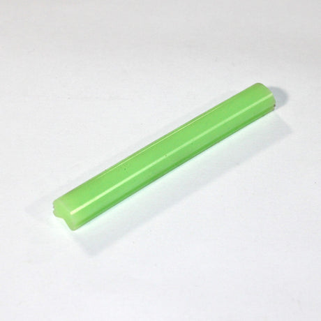 A single Marsella Flexible Color Diffuser for LED Strip, in light green, rests on a plain white surface, showcasing its sleek, pliable design ideal for architectural lighting and LED applications.