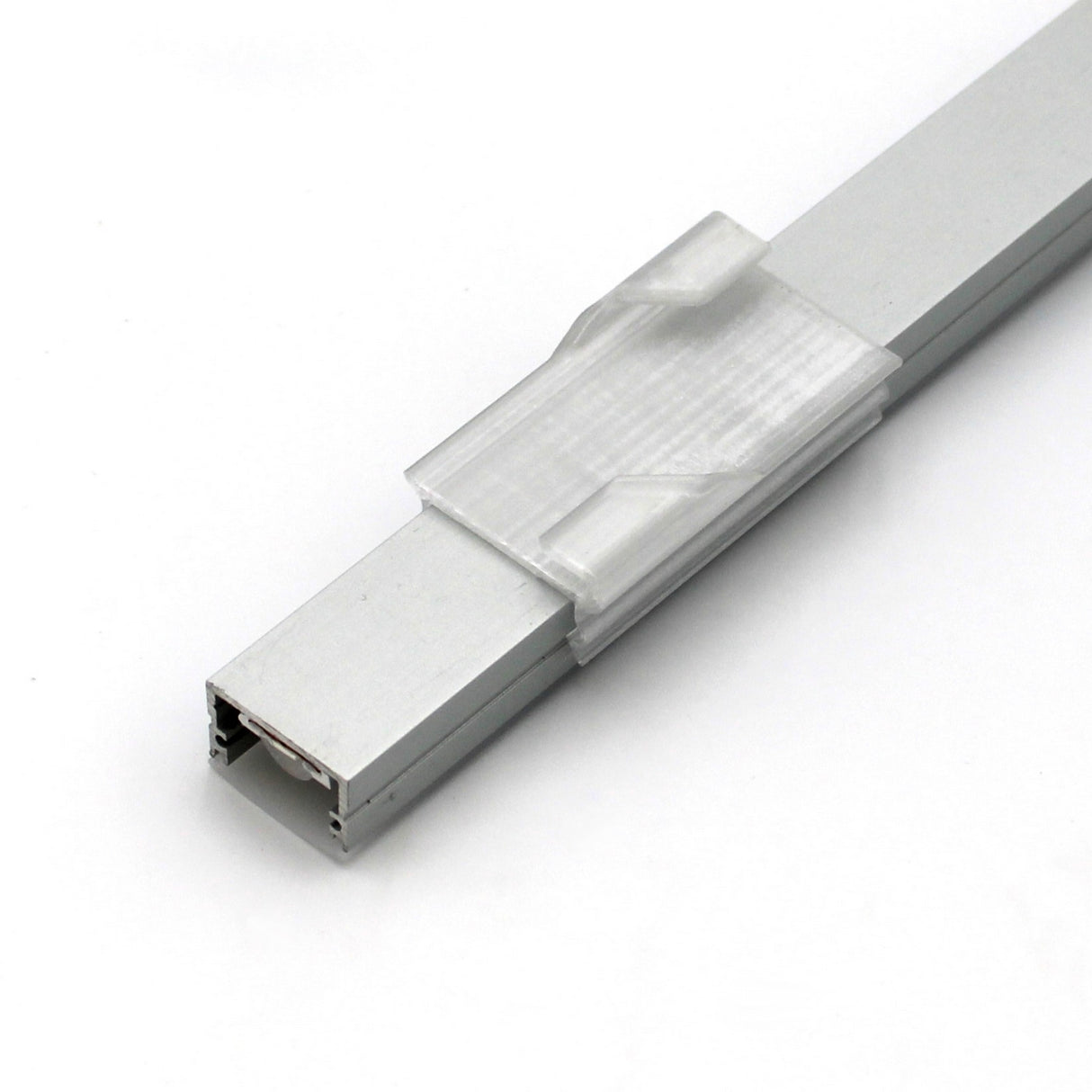 The Roma XL Drop Ceiling Clip, a translucent 3D printed attachment, is shown mounted on a rectangular metallic Roma XL profile rail against a white background.