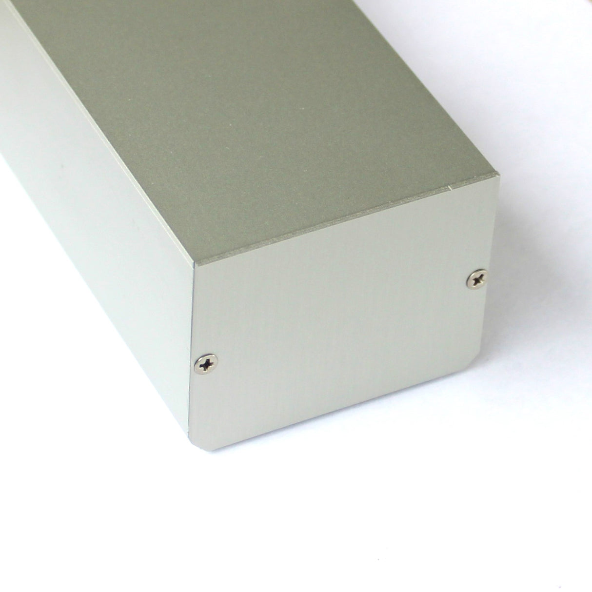 A close-up of the Custom PL55 J-Box’s corner, showing its brushed metallic finish and two small screws on the end panel—ideal for Linear J-box or LED profiles—set against a white background.