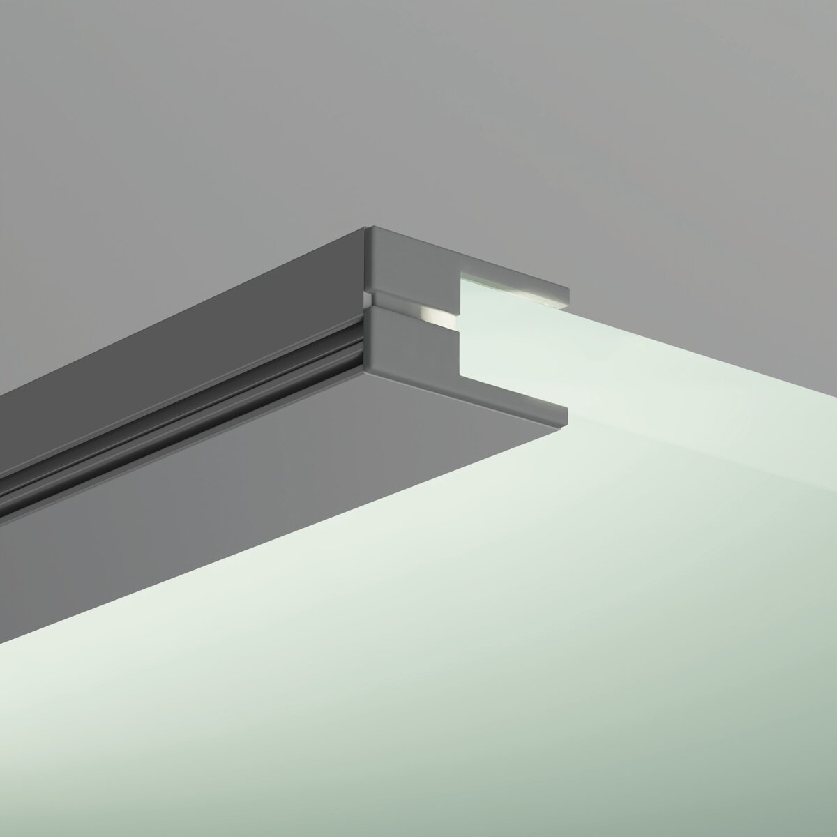 Close-up of a glass panel installed in a KRAV-810 recessed aluminum channel, finished with the End Cap for KRAV-810 Profile, all set against a neutral background.