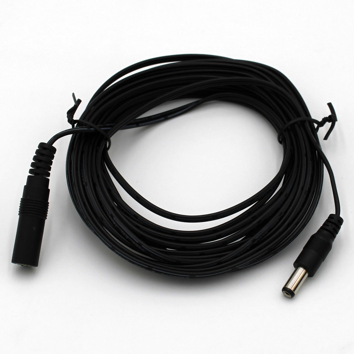 A 10ft Power Supply Extension Cable in black, featuring male and female barrel plug connectors, is coiled neatly on a white surface.