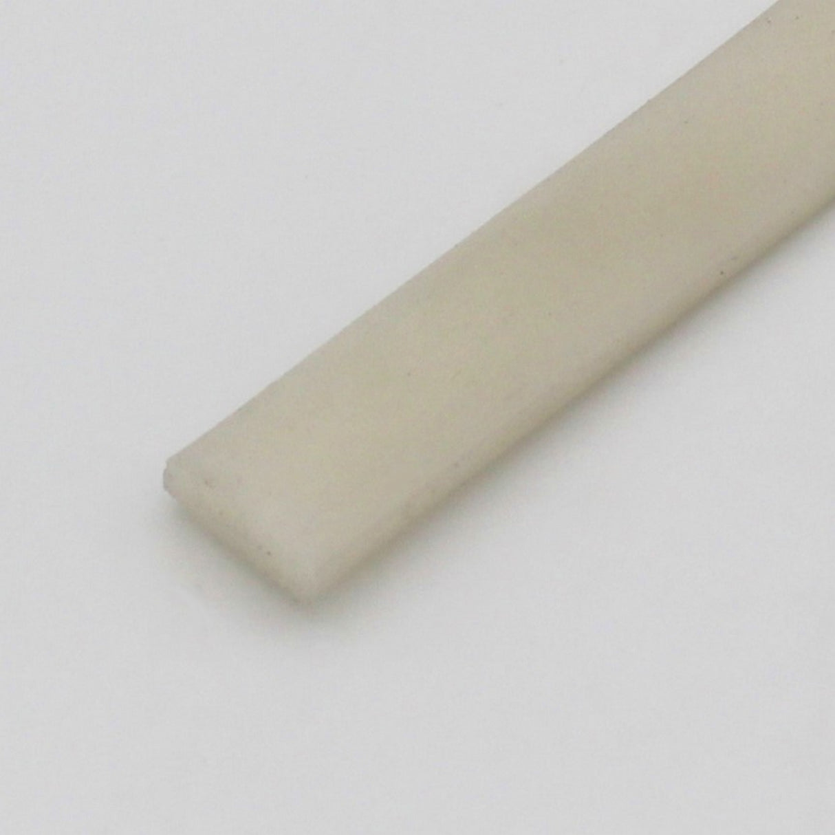 A close-up of the rectangular, flat, off-white Upper cover for Niza Duo is shown on a plain light background.