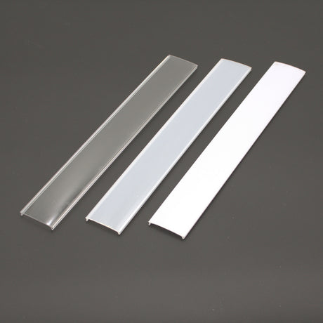 Three rectangular Diffuser for SLW10 covers—clear, frosted, and opaque white—are displayed side by side on a dark surface, suitable for use with the ALU45-Wide profile.