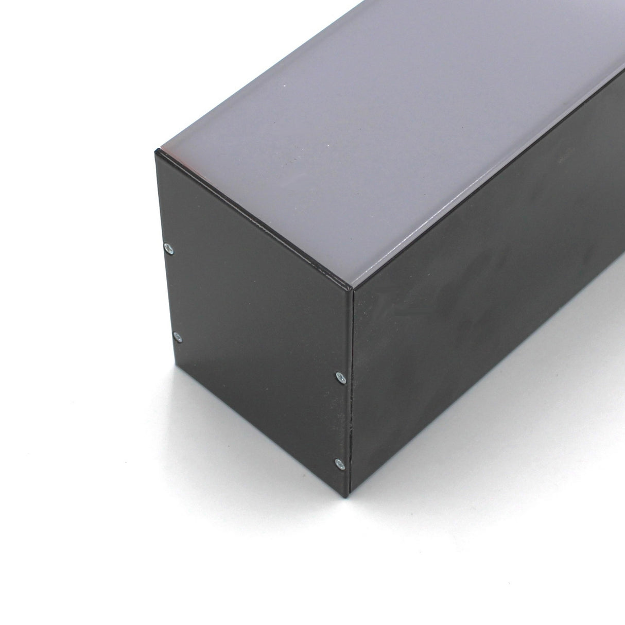 A close-up of the black Direct/Indirect Linear Pendant Lighting LED Channel (Model DPL70FL) with a smooth, light gray heat-dissipating top, side screws visible, shown on a white surface.