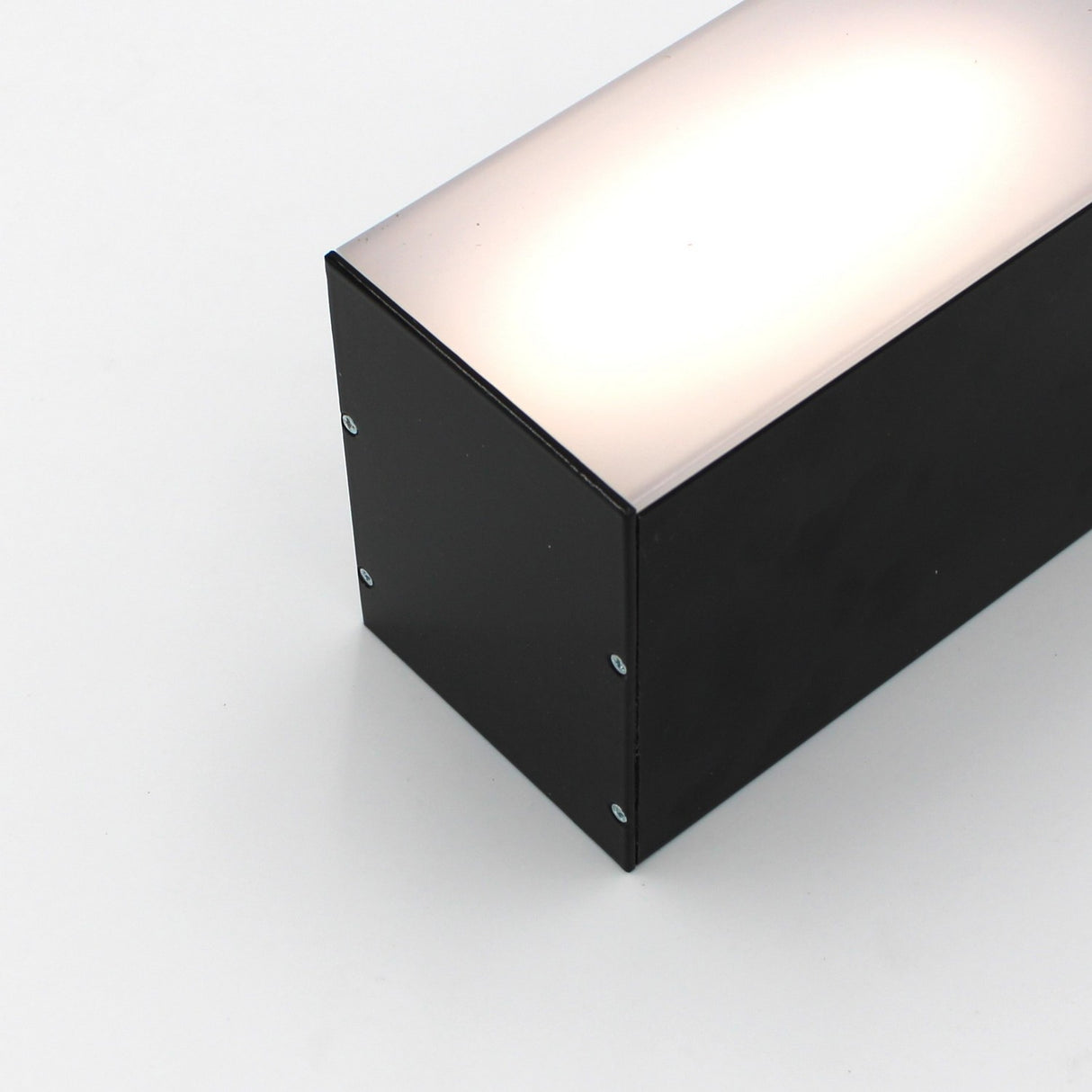 The Direct/Indirect Linear Pendant Lighting LED Channel (Model DPL70FL) is a rectangular black metal fixture with a frosted illuminated top for heat dissipation, pictured here on a plain white background.