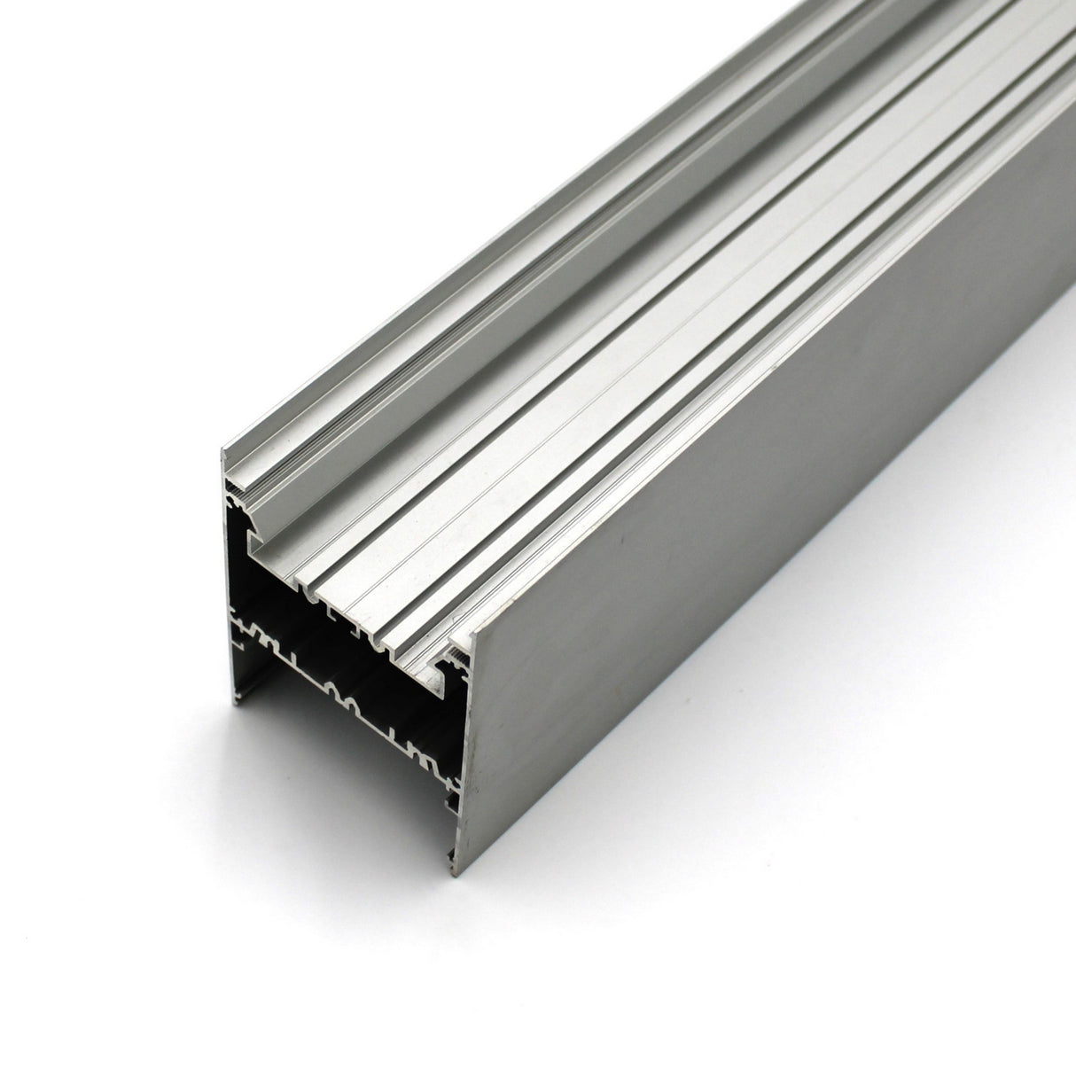 A close-up of the Direct/Indirect Linear Pendant Lighting LED Channel ~ Model DPL70FL, a silver aluminum extrusion with multiple grooves and channels, ideal for structural framing, industrial use, or housing high-power LED strips.
