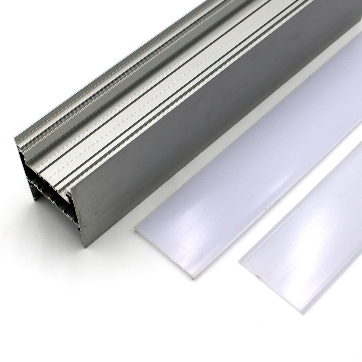 A close-up of the Direct/Indirect Linear Pendant Lighting LED Channel, Model DPL70FL, in silver aluminum with two frosted white diffuser covers on a white surface—perfect for modern linear lighting installations.