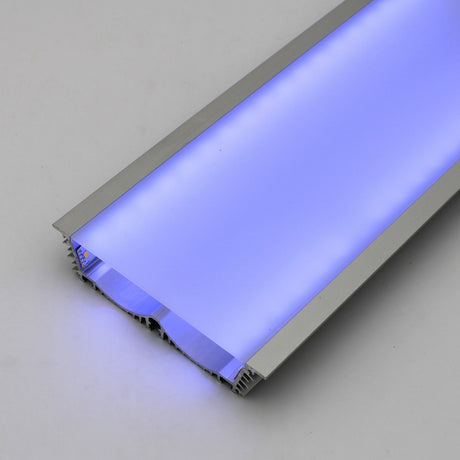 The 4.5 Large Recessed LED Channel (Model RPLW116) features a frosted cover, extra-wide light output, silver metallic frame, and emits a soft blue glow on a plain, light-colored surface.