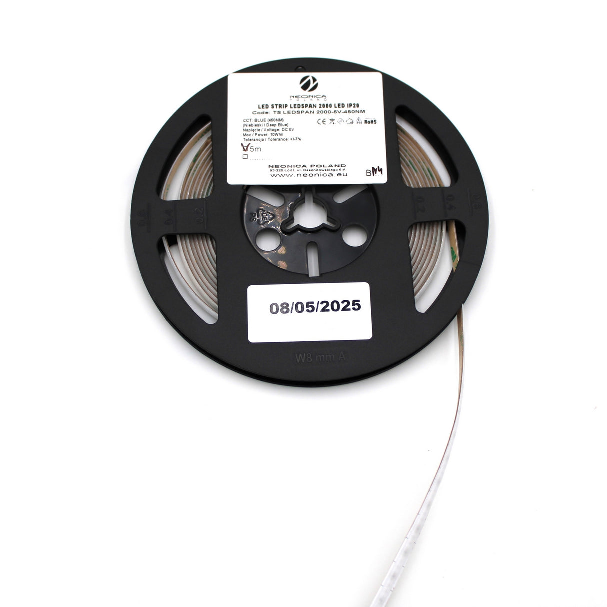 A reel of 450nm COB IP20 LED Strip For Medical Lighting (5V) ~ Aloe Vera Series features a white technical label and a date label (08/05/2025). The unspooled strip emits blue light, ideal for phototherapy.