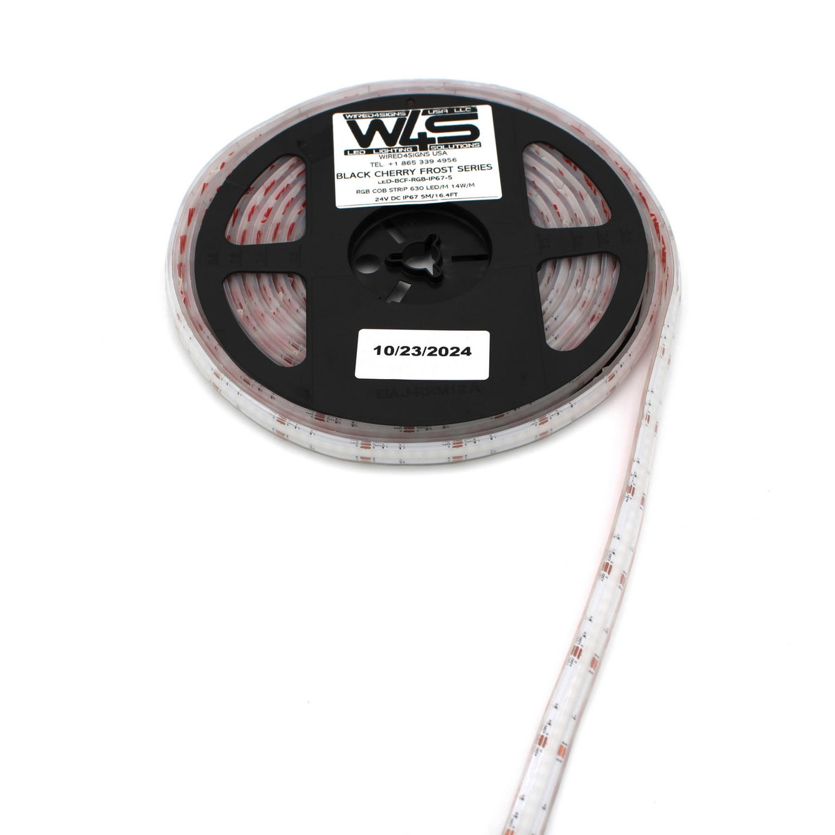 A partially unrolled reel of RGB COB IP67 LED Strip (24V) ~ Black Cherry Frost Series by WLS, featuring a flexible, dimmable RGB COB LED strip with a white sticker dated 10/23/2024, extends outward.