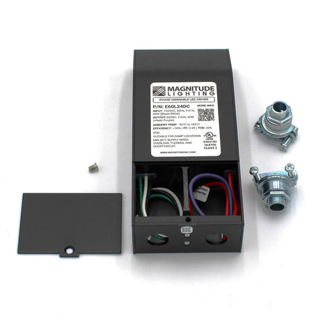 A Magnitude E Series Dimmable Class 2 Electronic LED Driver (24V) with its open cover exposes colored wires inside. Nearby are two metal connectors, a screw, and the detached cover. The label displays specs and phase dimmable support.