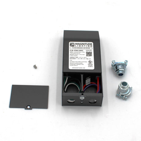 A Magnitude E Series Dimmable Class 2 Electronic LED Driver (24V) is shown on a white surface with exposed wiring, its cover removed, a screw, and two metal cable connectors.