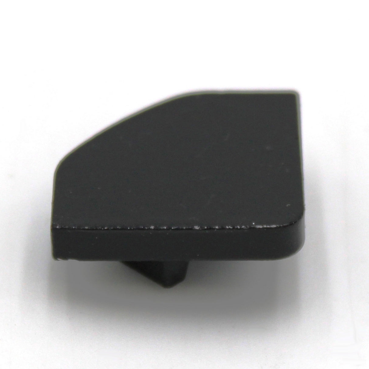 A small black plastic Single End cap for LED Channel ~ Alu-45, featuring a flat design with a slightly angled edge and protruding tab, displayed against a white background.