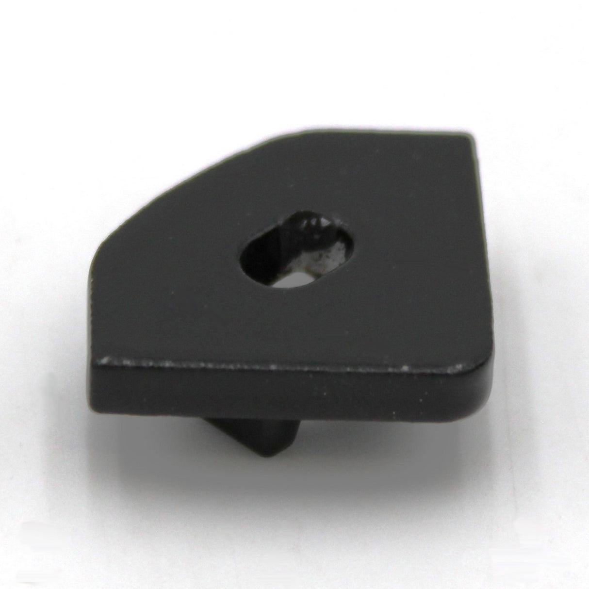 A small, flat black end cap with an off-center hole and smooth, irregularly rounded rectangular shape fits the Alu-45 profile. Designed for LED Channel lighting fixtures. Product: Single End cap for LED Channel ~ Alu-45. Plain white background.