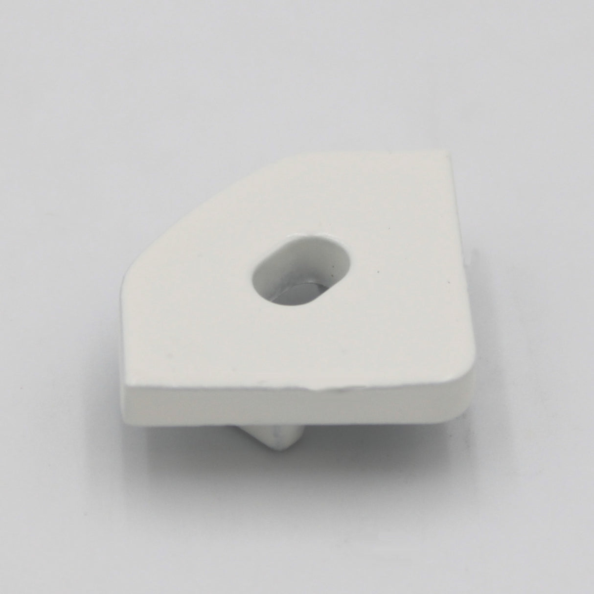 A small, white Single End cap for LED Channel ~ Alu-45 with a flat, beveled edge and central hole is shown on a plain white surface.