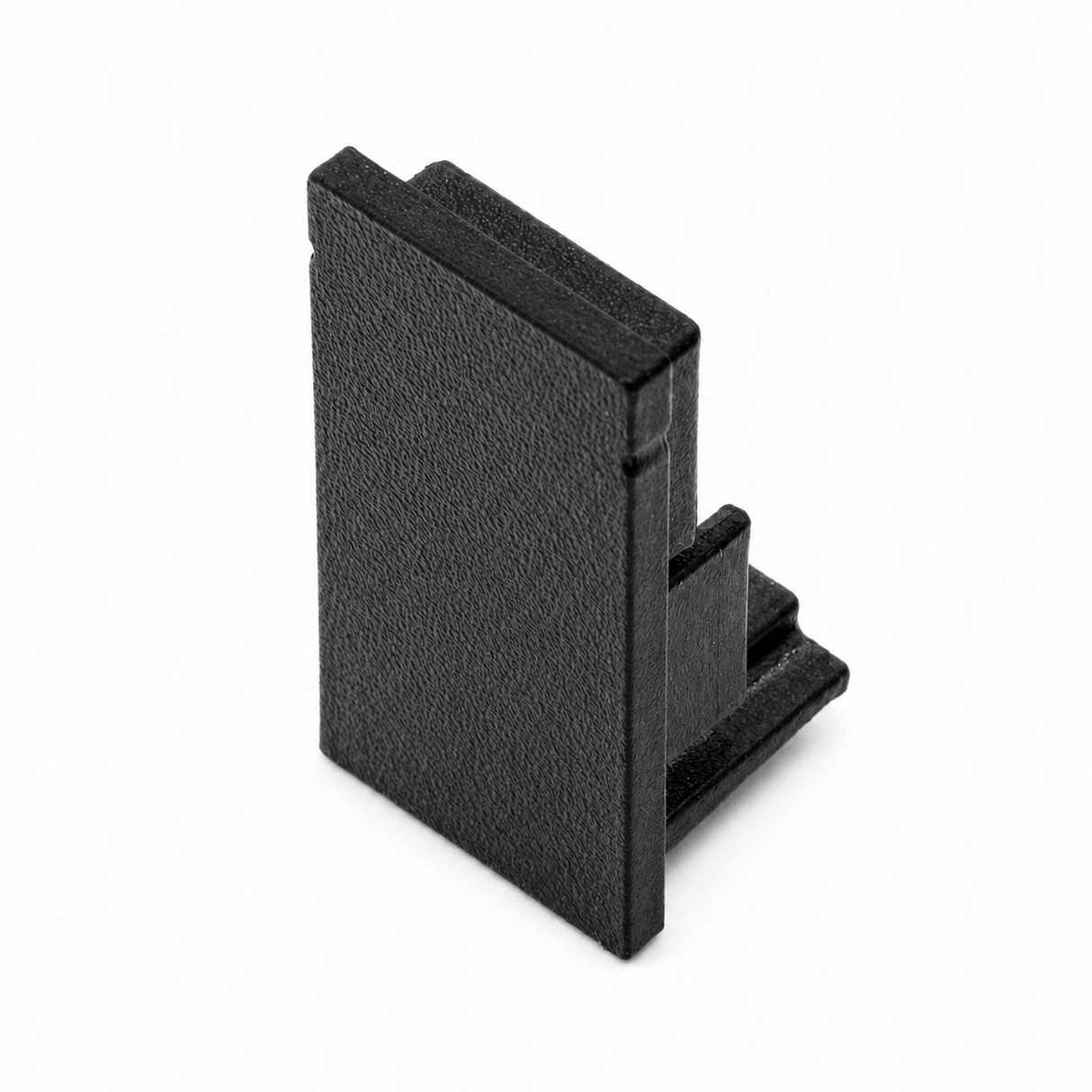 The Plastic End Cap for Hannover Profile is a black, rectangular, 3D printed piece with a textured surface and stepped edges, made in the USA and shown upright on a white background.