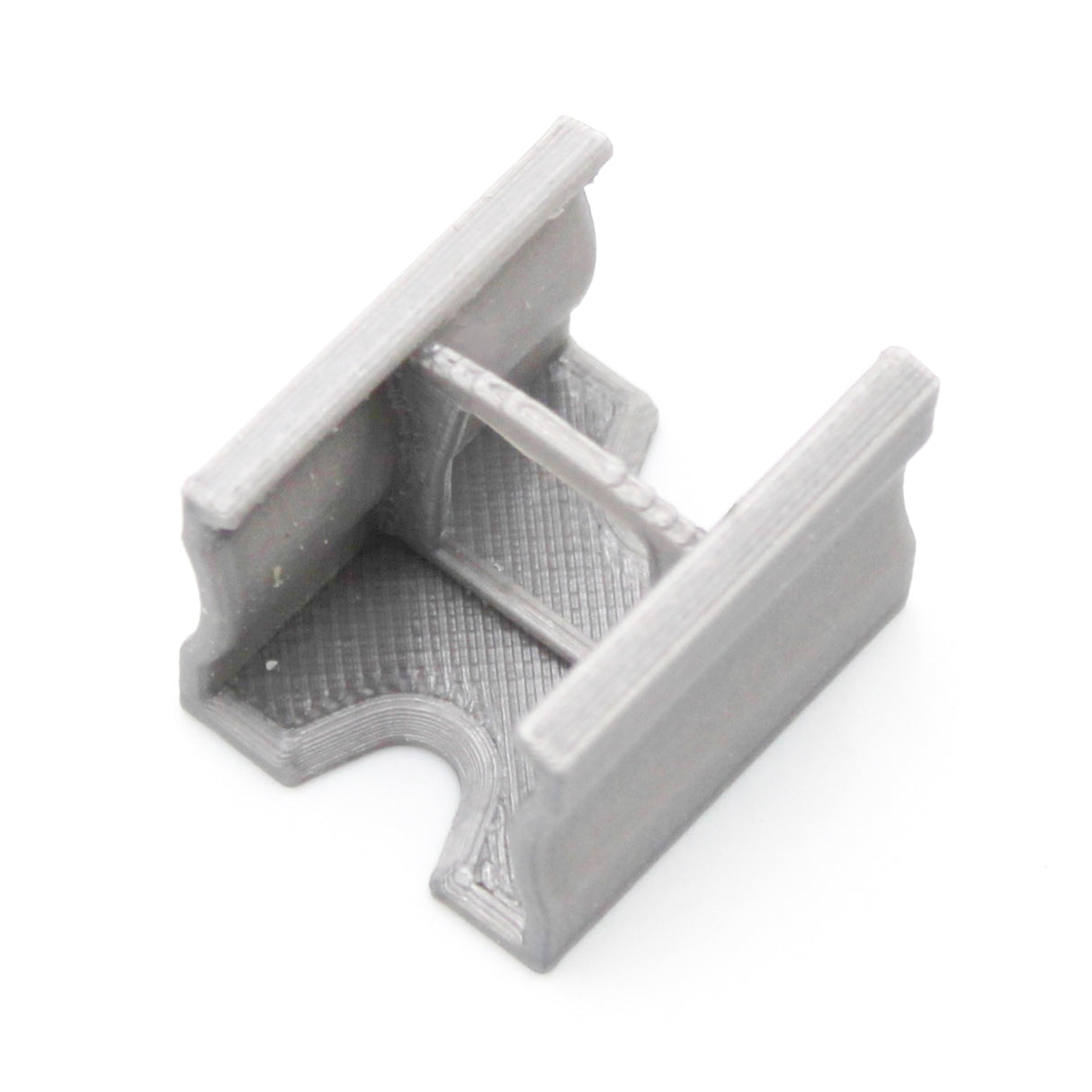 A compact gray Linear Connector for SL15 Profile, 3D-printed in PETG, with a U-shaped opening, squared edges, and central reinforcement bridge. Shown against a white background.