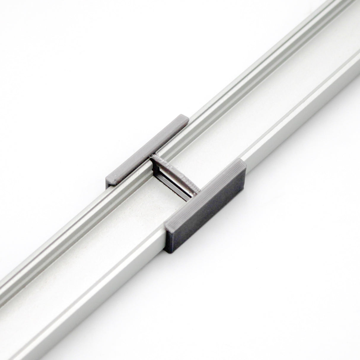 A close-up of two SL7 Profiles connected by a Linear Connector for SL7 Profile, shown against a white background.