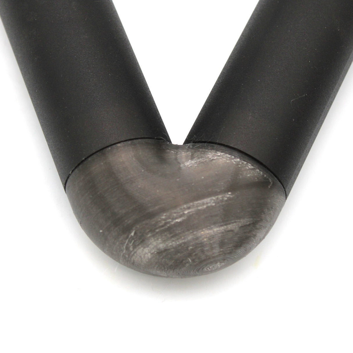 Close-up of a translucent Elbow for Oslo Profile, featuring a V-shape with a metallic, rounded connector joining the two arms, shown against a white background.