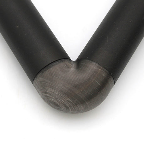 Close-up of a Translucent Elbow for Oslo Profile, bent at a smooth 90-degree angle with faint grinding marks visible along the curve.