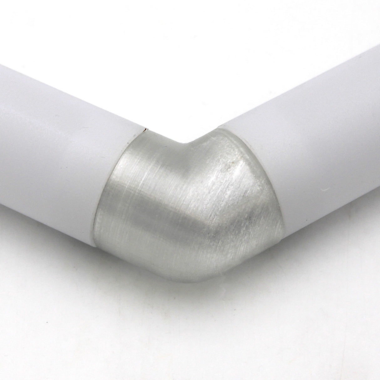 A close-up of two white Oslo Profile tubes connected by a Translucent Elbow, forming a right angle against a white background.