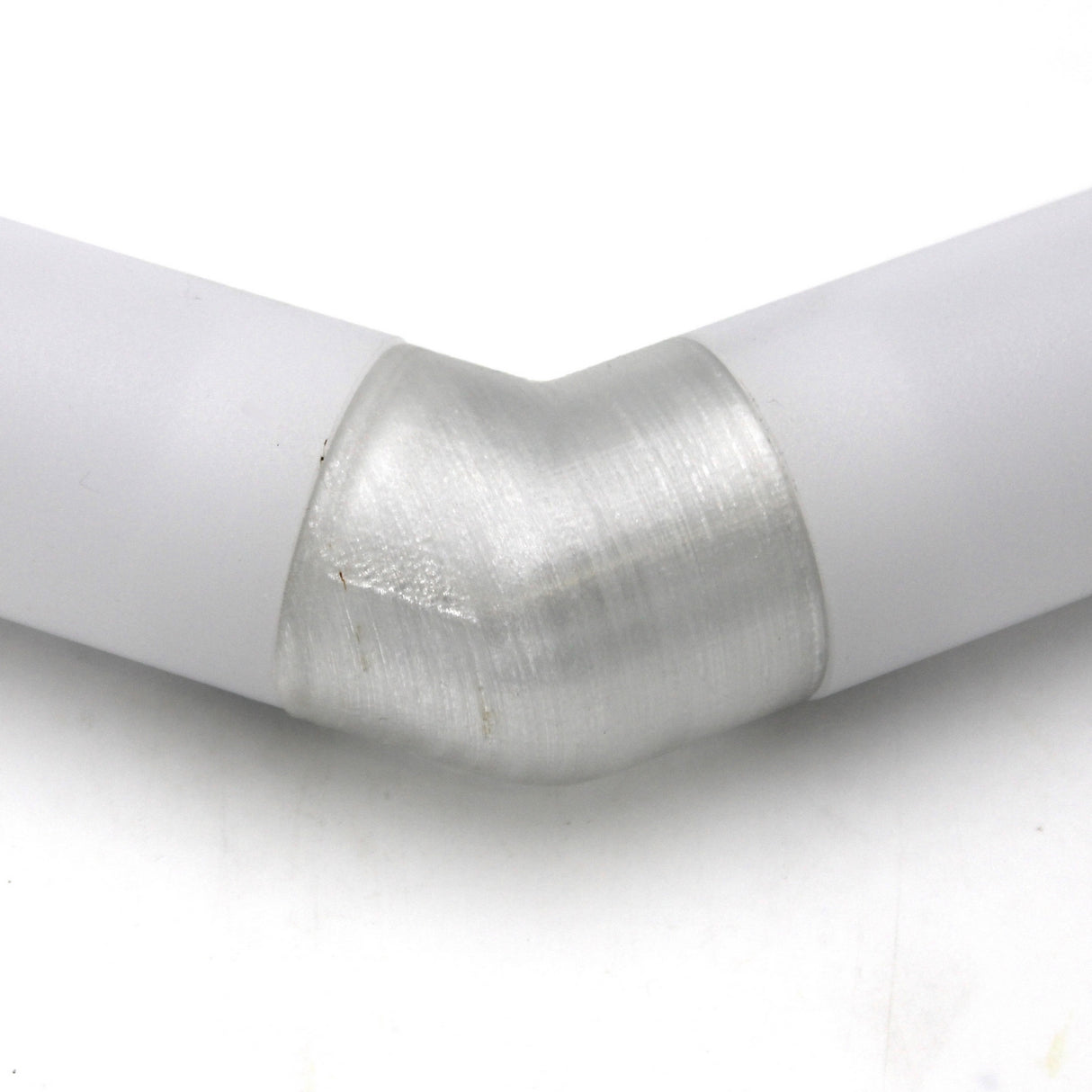 Close-up of two Oslo Profile tubes connected at an angle by a Translucent Elbow, all in white PETG material, on a plain white background.