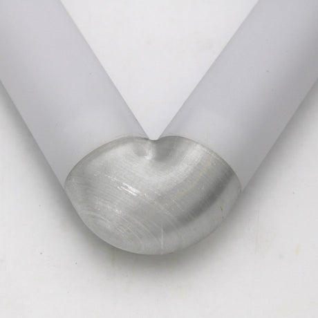 Close-up of two Oslo Profile rods joined at a 90-degree angle by the Translucent Elbow, creating a smooth, rounded corner with a matte silver finish against a plain white background.