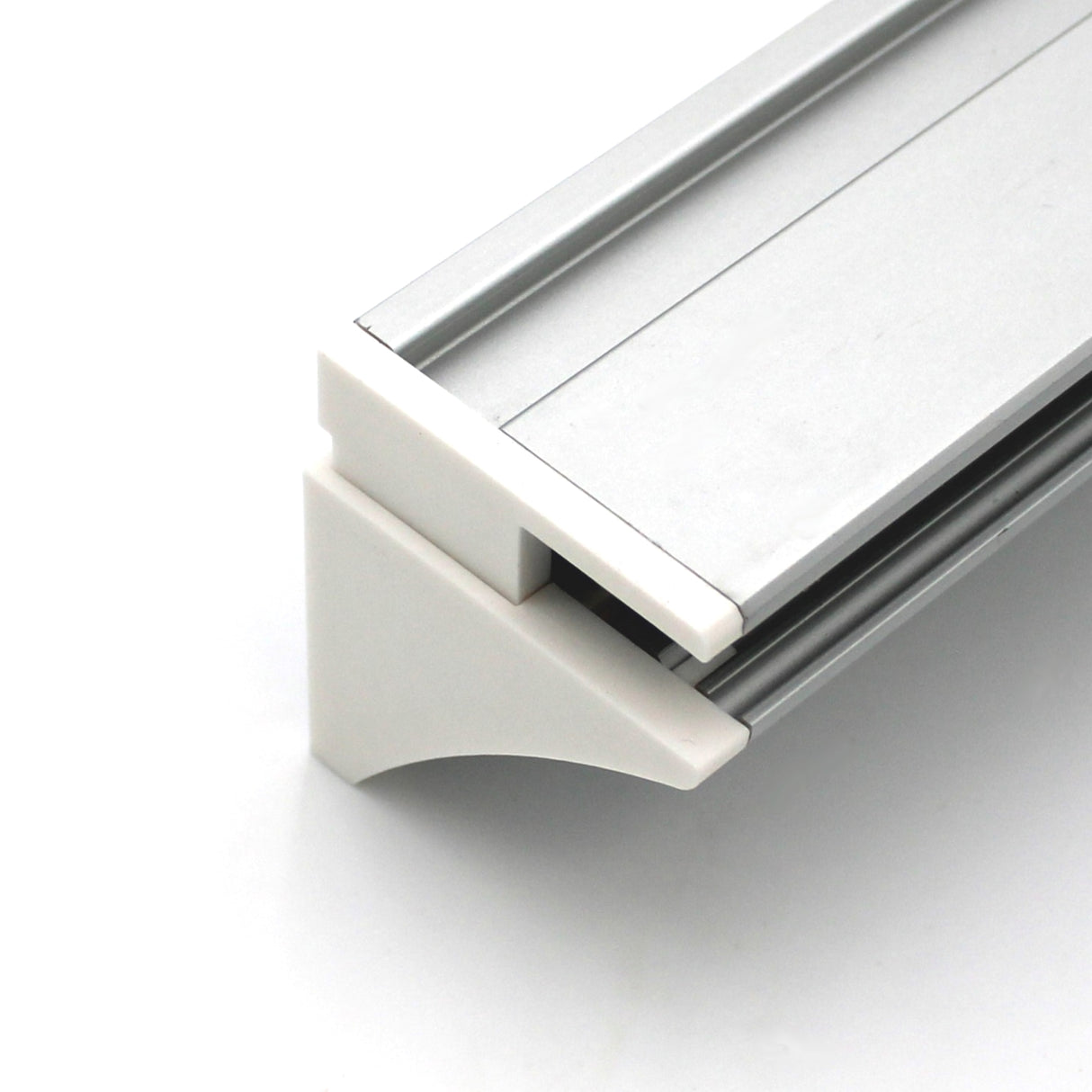 Close-up of the End Cap for Pula P10 Profile attached to a silver aluminum extrusion, featuring a white PETG corner connector, displayed against a plain white background.