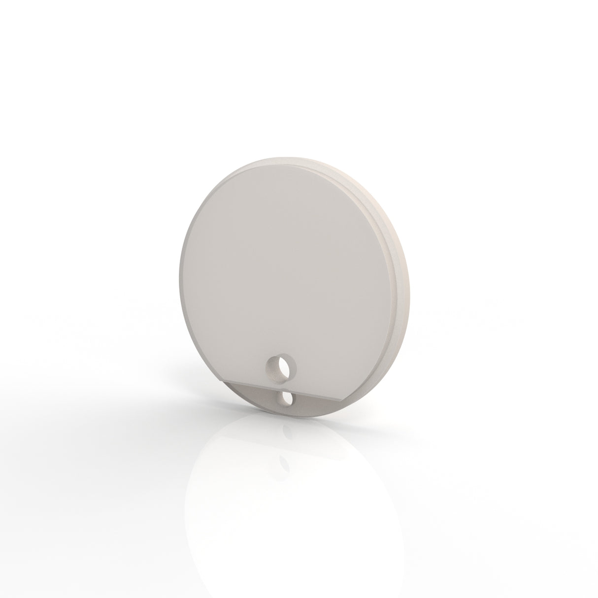 A round, flat, light gray Plastic End Cap for Sierra65 Profile with a small and a larger hole near its edge stands upright on a white reflective surface.