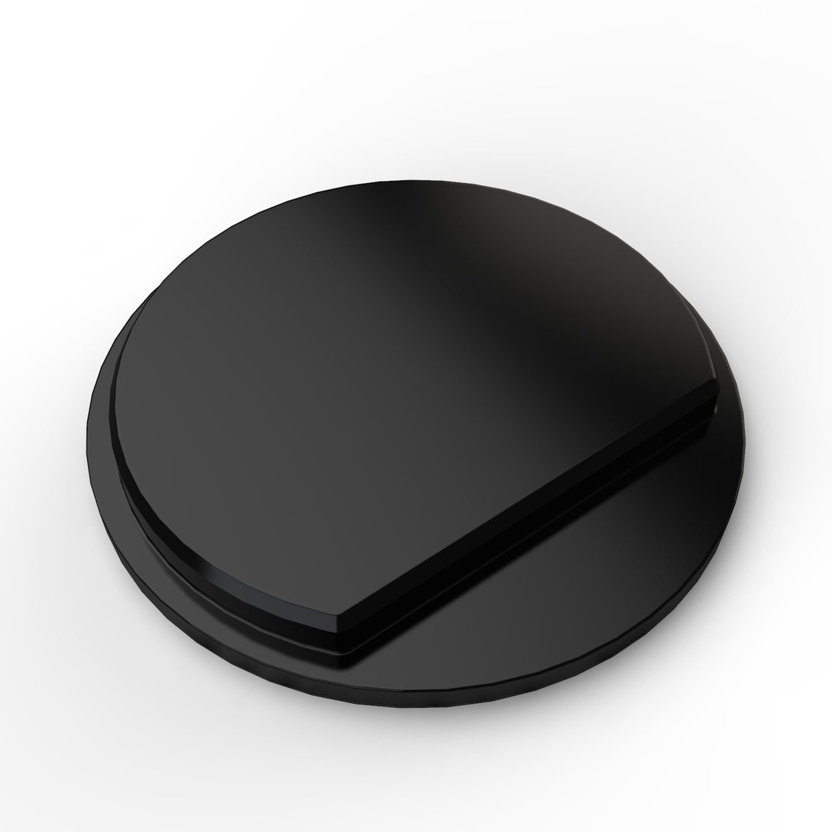 A black, round, flat Plastic End Cap for the Cascade38 Profile with a slightly raised angled section on one side, pictured against a white background.