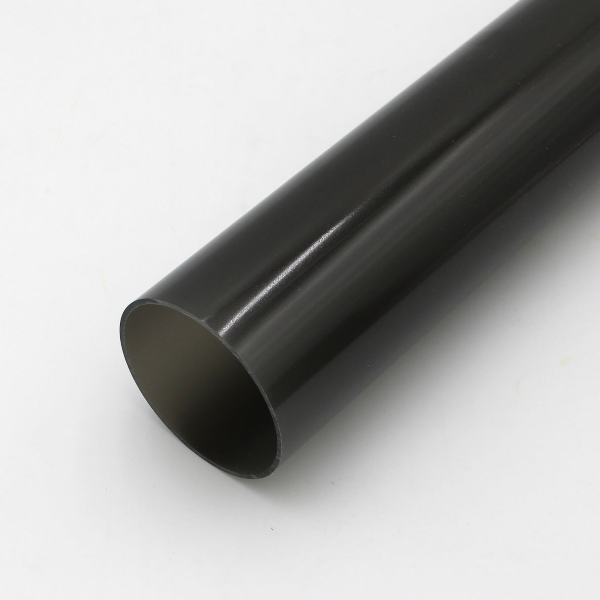 A close-up shows the 2.75 Round Polycarbonate LED Lighting Tube (Model Smokies70) in black, placed diagonally on a white surface with its open end facing the camera, ideal as an LED diffuser.
