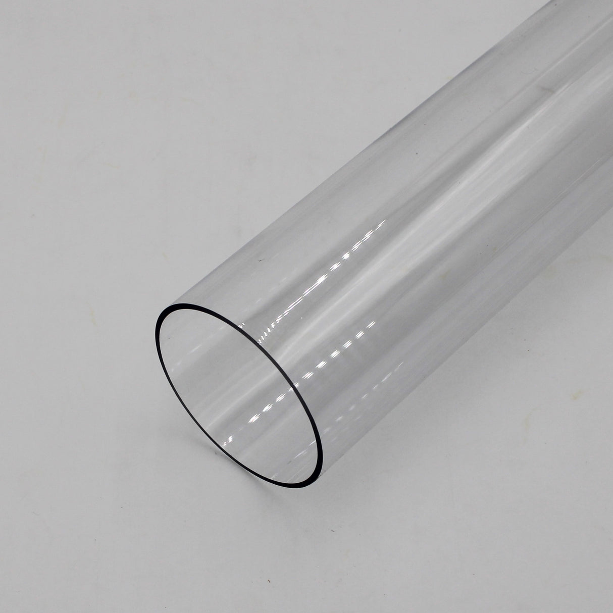 The 2.75 Round Polycarbonate LED Lighting Tube (Model Smokies70) is shown resting on a plain white surface, photographed at an angle to display its open, clear cylindrical end—ideal for LED diffuser lighting applications.